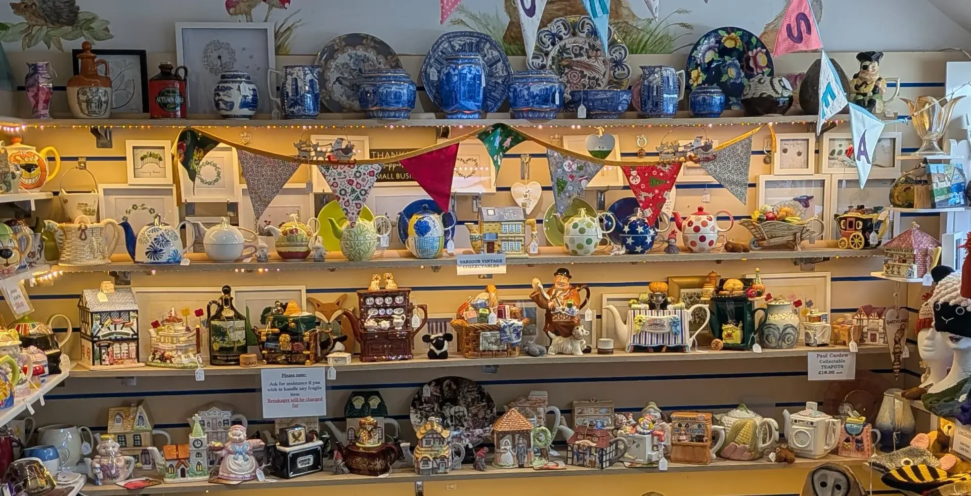 A display of colourful speciality and collectable teapots